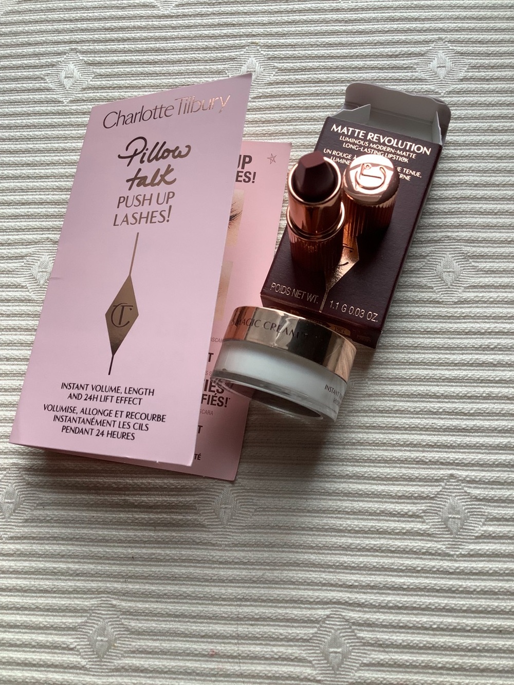 Charlotte Tilbury Travel Size Mascara, Matte Revolution Lipstick & Magic Cream.